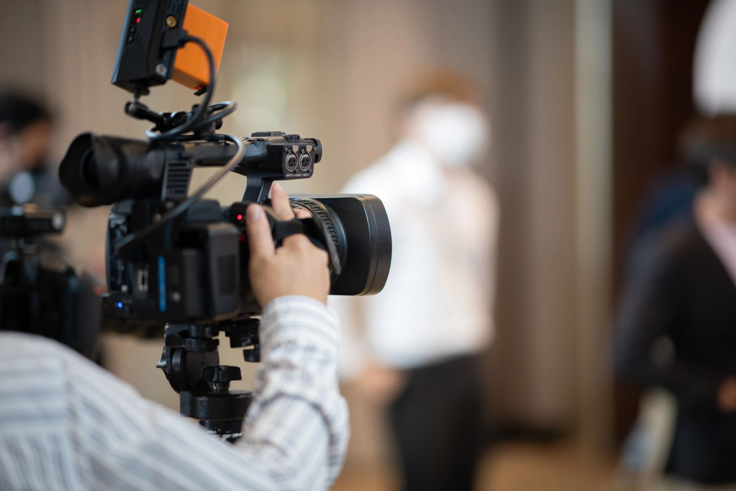 Close-up of a professional video camera representing documentary-grade observation